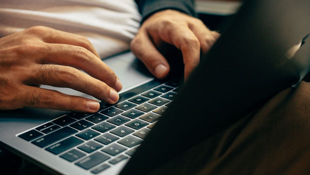 A man using people search stacking to find the phone number of a business owner.